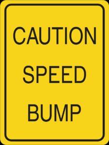 Speed bump warning sign